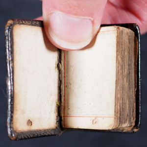 Biblia or a Practical Summary of Old & New Testaments. 1728. Wilkin, R. [London]. 1727. Underlined in red and hand corrected to 1728. Black binding.