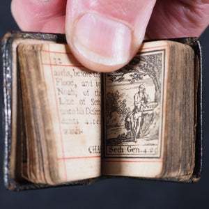 Biblia or a Practical Summary of Old & New Testaments. 1728. Wilkin, R. [London]. 1727. Underlined in red and hand corrected to 1728. Black binding.