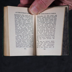 Dickens, Charles Christmas Stories. Birdsall & Sons [Northampton]. Circa 1908. Complete five volume set on original oak book display.