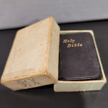 Load image into Gallery viewer, Holy Bible c1914  3/4&quot; x 1 1/4&quot;  Bound in black leather with gilt title to front cover and spine. Gilt edges.  Contained in an unmarked cardboard box
