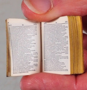 Smallest English Dictionary in the World. Comprising: besides the ordinary and newest words in the language, short explanations of a large number of scientific, philosophical, literary and technical terms. [SOLID SILVER LOCKET].1893. >>MINIATURE BOOK<<